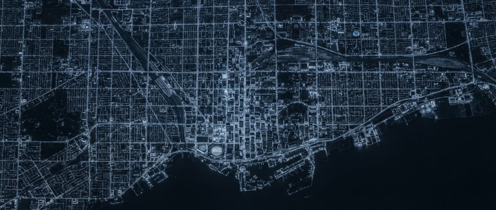 Toronto street grid glowing at night, seen from above